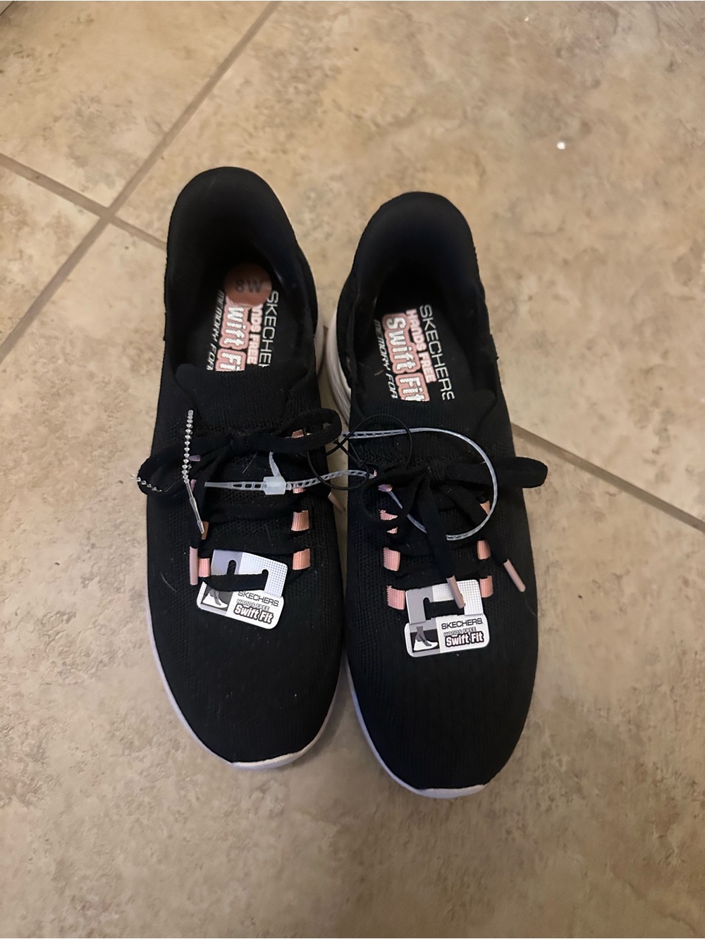 Skechers Black Slip-On Trainers with Pink Logo Accent